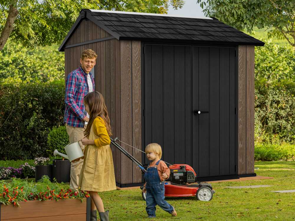keter-signature-walnut-757-775-gertehaus-mit-fenstern-230-x-223-x-246-cm-gartenhaus-aus-kunststoff-signature-walnut-757-775-68507_1_1763028126_IMG_6915ac9e839c6.jpg Keter Signature Walnut 757/775 – Gerätehaus – Mit Fenstern – 230 x 223 x 246 cm – Image 1